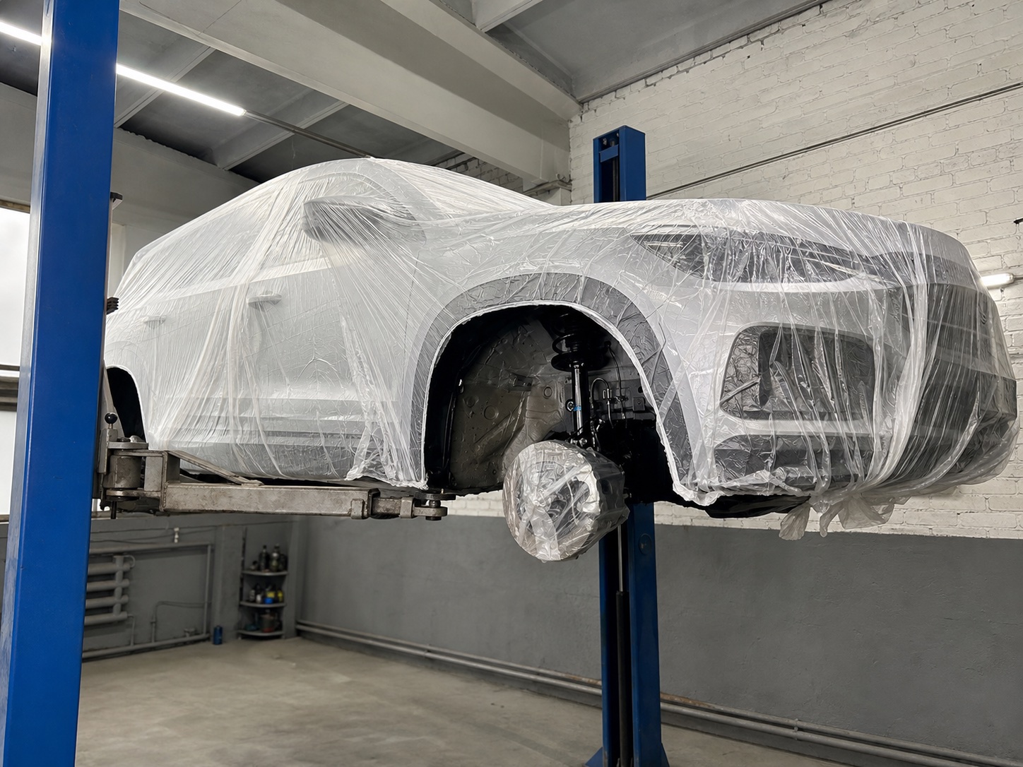 Vehicle carefully wrapped and masked before rustproofing treatment